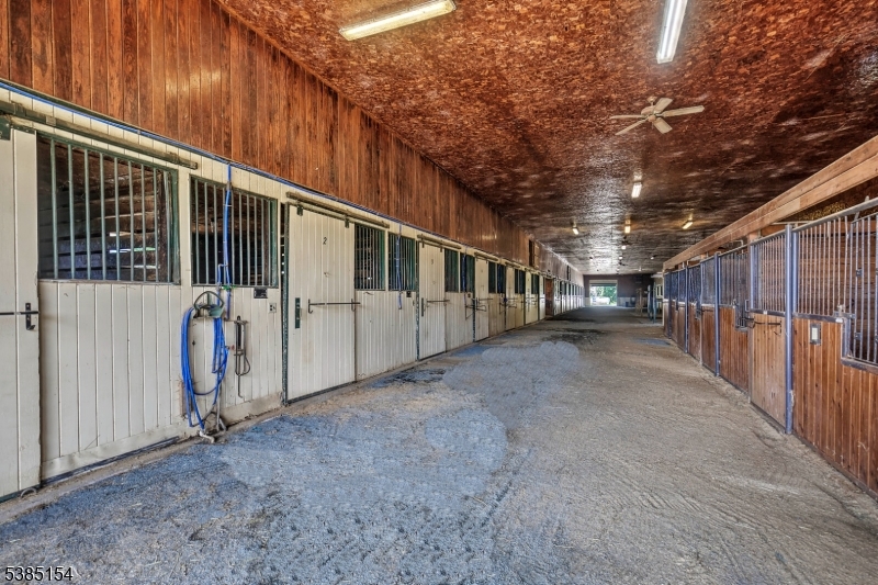 245 Old Turnpike Road Califon, NJ 07830 - Photo 9 of 31 a view of a porch with wooden walls and stairs