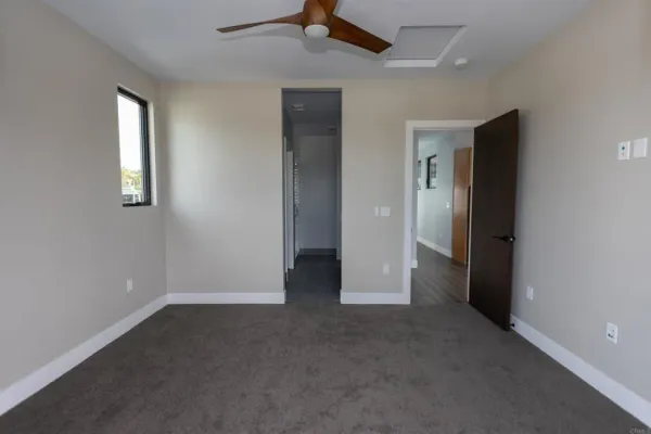 an empty room that has a window in it
