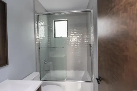 a bathroom with a bathtub and a shower