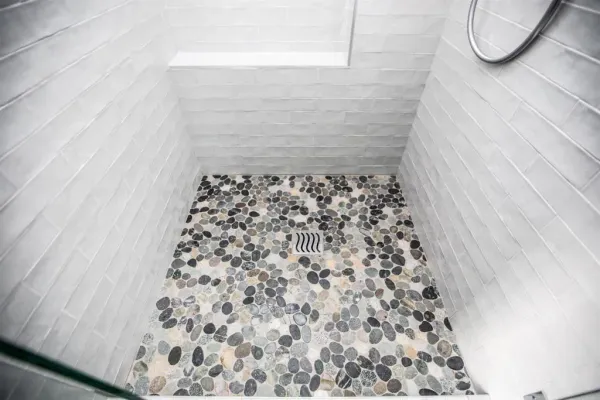 a bathroom with a bathtub and shower
