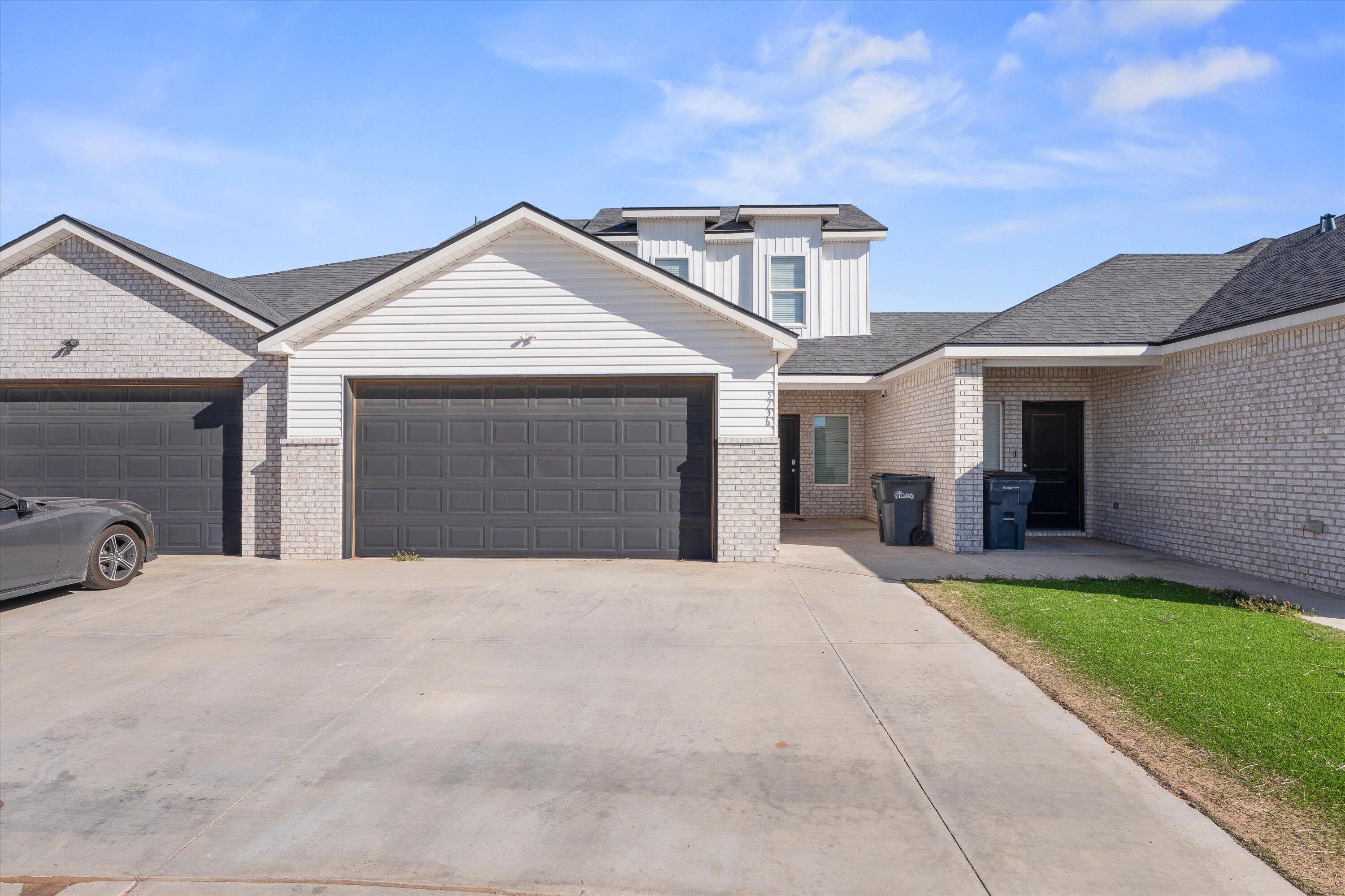 5736 Lehigh Street Lubbock, TX 79416 - Photo 1 of 23 a front view of a house with a yard and garage