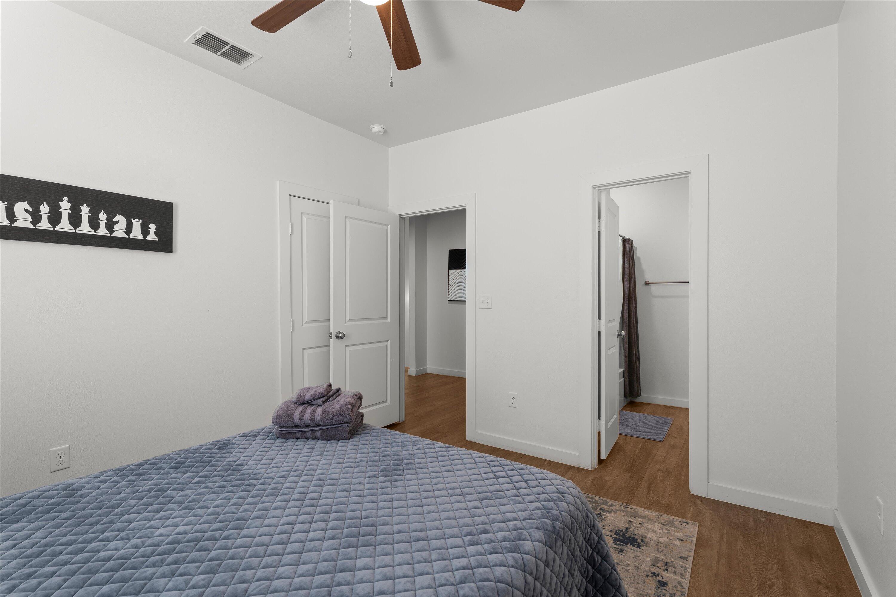 5736 Lehigh Street Lubbock, TX 79416 - Photo 19 of 23 a bedroom with a bed and a view of closet
