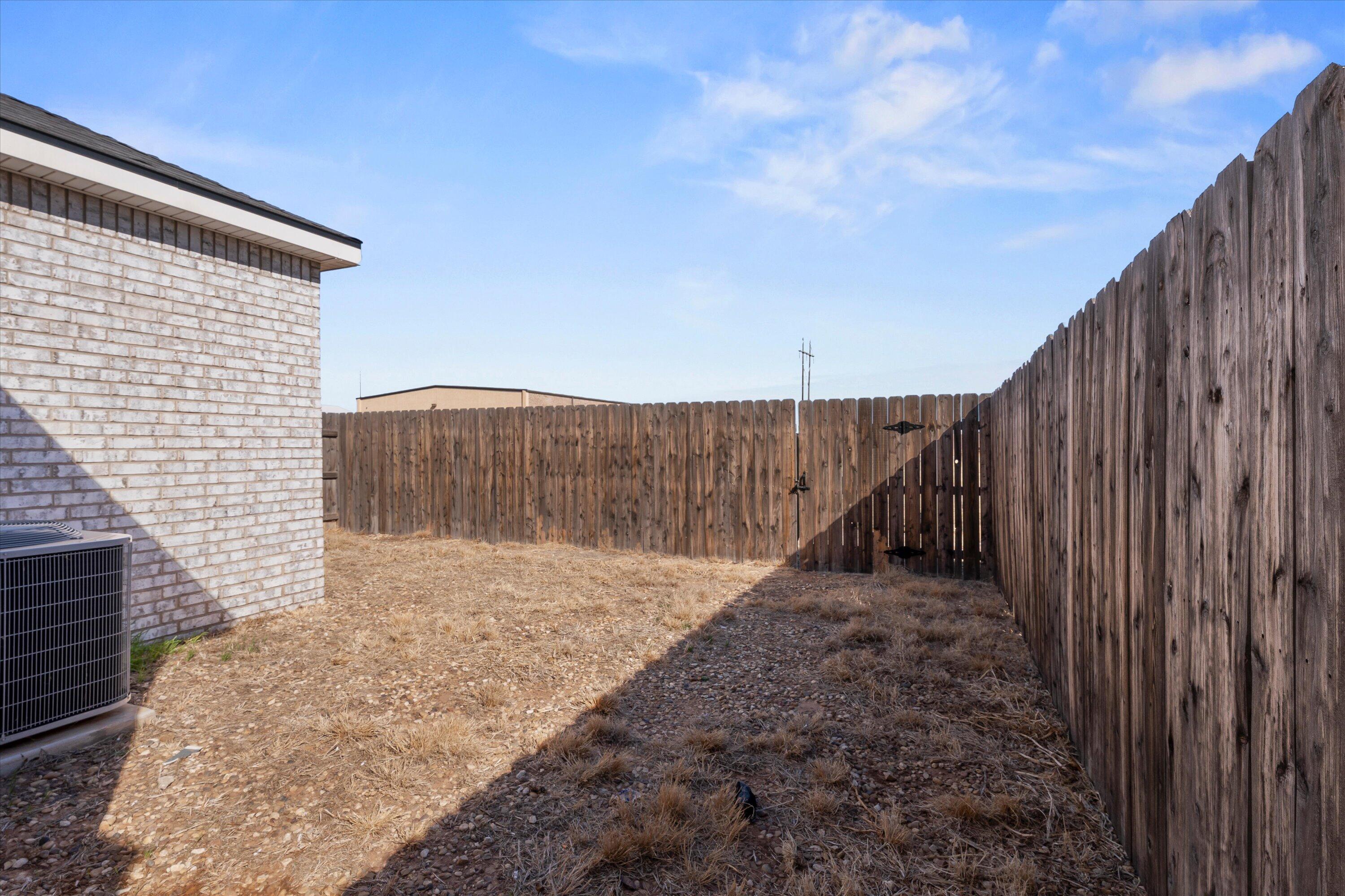 5736 Lehigh Street Lubbock, TX 79416 - Photo 22 of 23 a backyard of a house