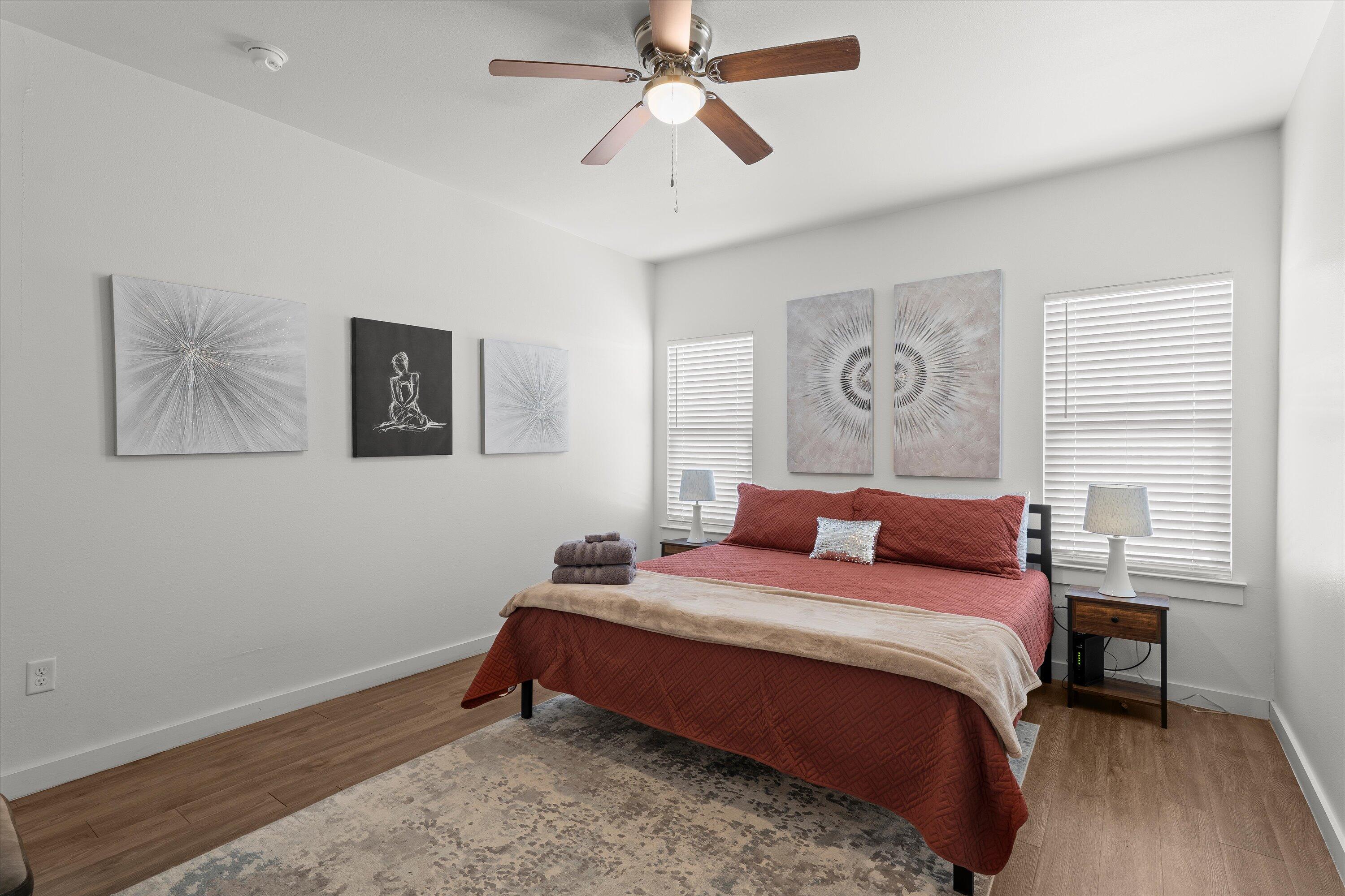 5736 Lehigh Street Lubbock, TX 79416 - Photo 10 of 23 a bedroom with a bed and wooden floor