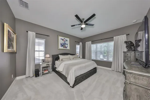 a view of walk in closet with clothes