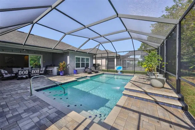 a view of a backyard with sitting area