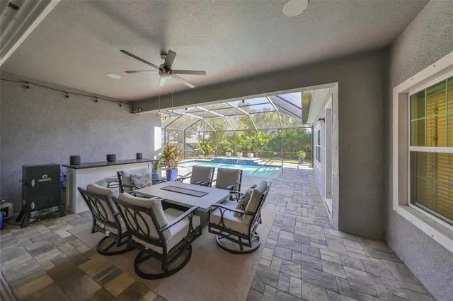 an aerial view of a house with outdoor space and lake view