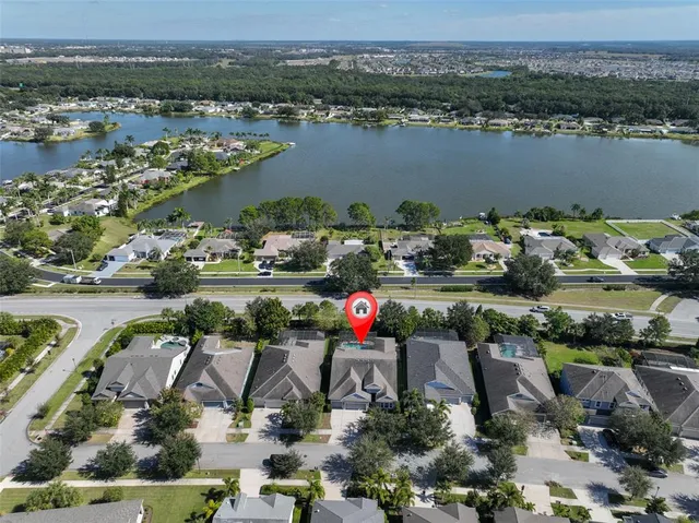 a view of a patio with a table and chairs under an umbrella
