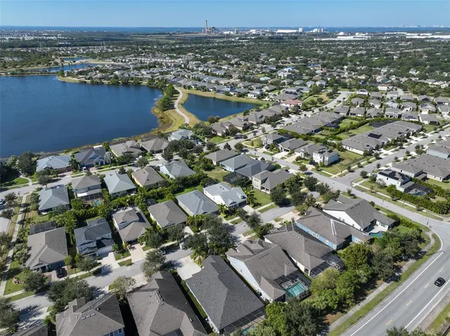 a view of a swimming pool with an outdoor seating