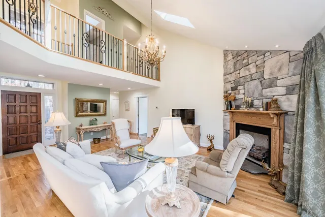 a living room with furniture or couch and a wooden floor