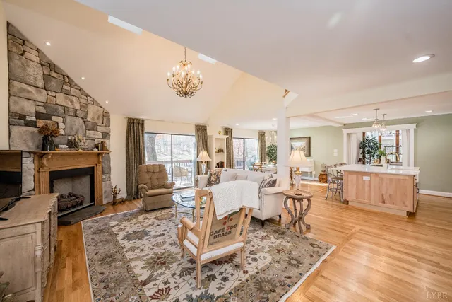 a large kitchen with kitchen island a counter space a sink and stainless steel appliances