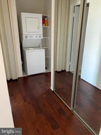 an entryway with wooden floor