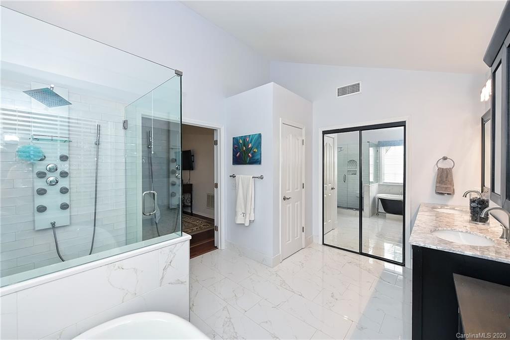 331 Matthews Estates Road Matthews, NC 28105 - Photo 22 of 32 a en suite bathroom with a shower sink and mirror