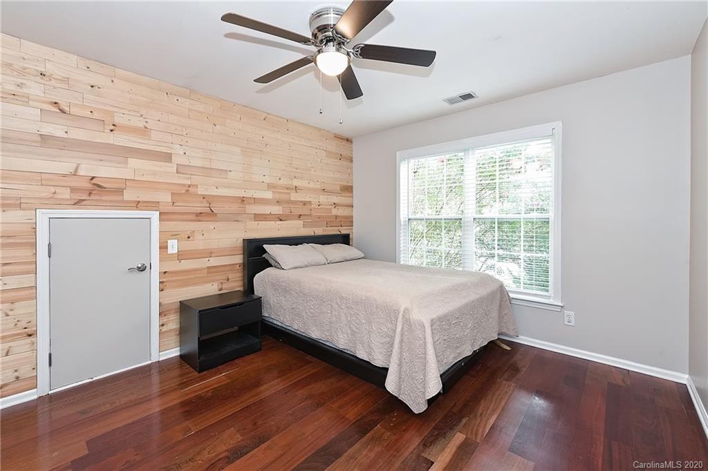 331 Matthews Estates Road Matthews, NC 28105 - Photo 23 of 32 a bedroom with a bed and a ceiling fan