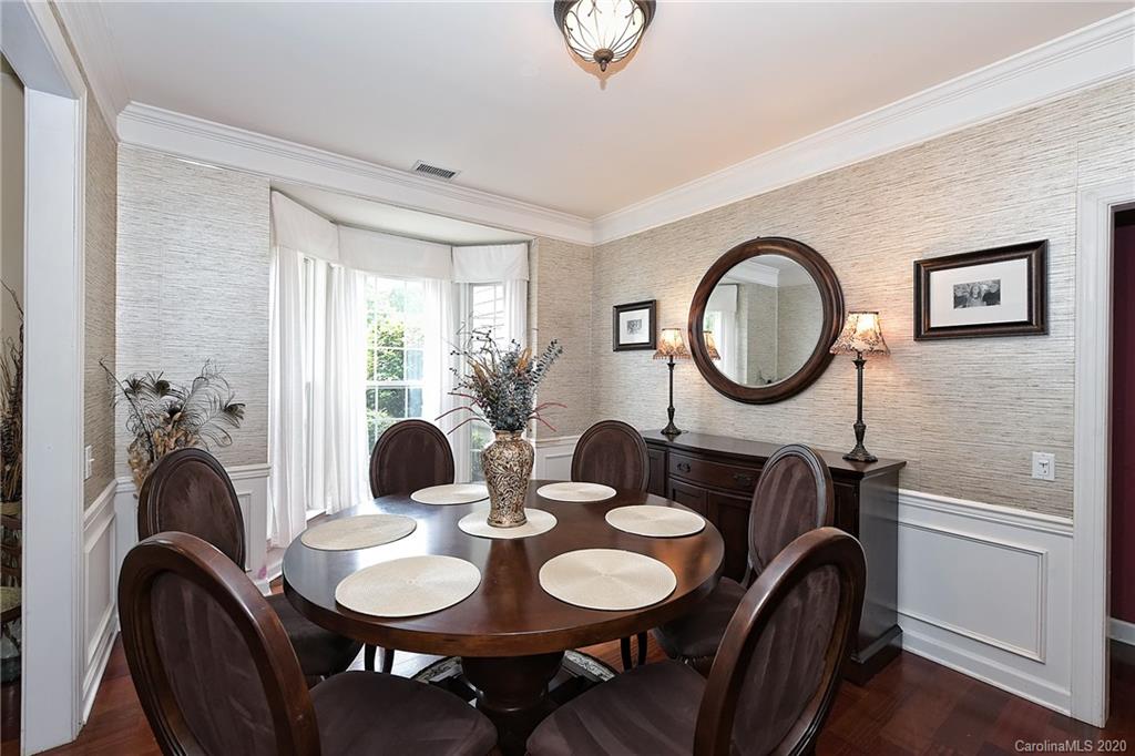 331 Matthews Estates Road Matthews, NC 28105 - Photo 5 of 32 a dining room with furniture and a mirror