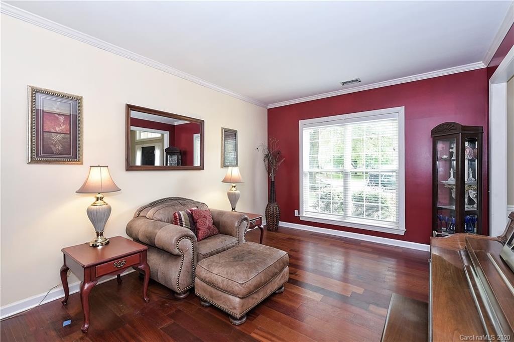 331 Matthews Estates Road Matthews, NC 28105 - Photo 7 of 32 a living room with furniture and a window