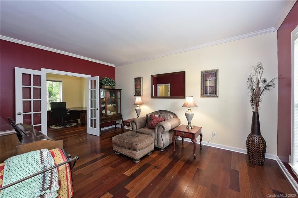 331 Matthews Estates Road Matthews, NC 28105 - Photo 8 of 32 a living room with furniture and a wooden floor