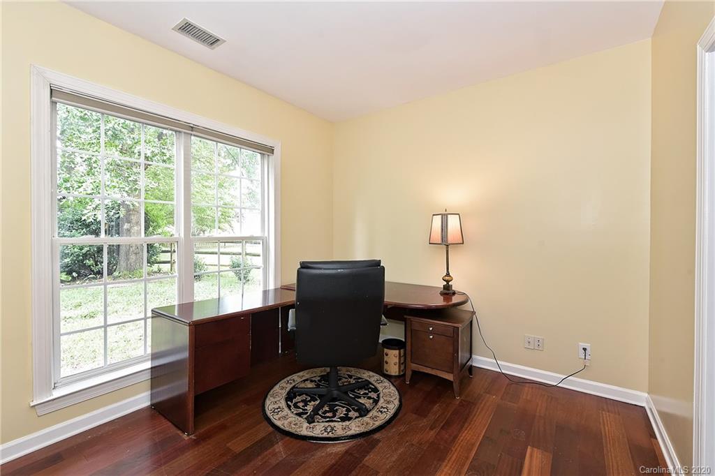 331 Matthews Estates Road Matthews, NC 28105 - Photo 9 of 32 a view of a workspace with furniture and a window