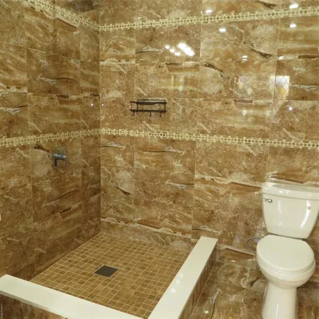 a bathroom with a sink a mirror and a bathtub