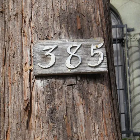 a view of table with chairs and cabinets