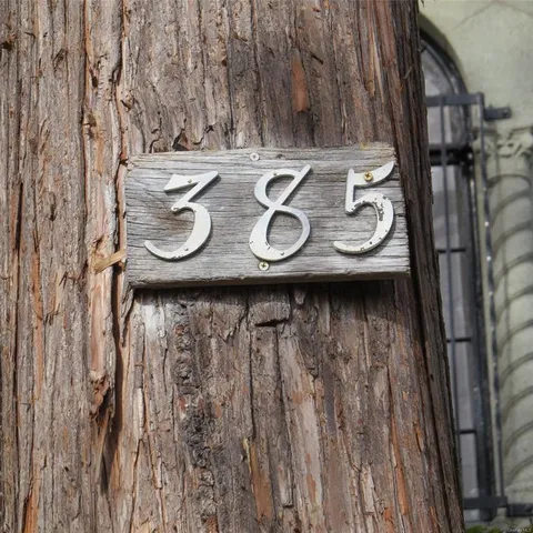 a view of table with chairs and cabinets
