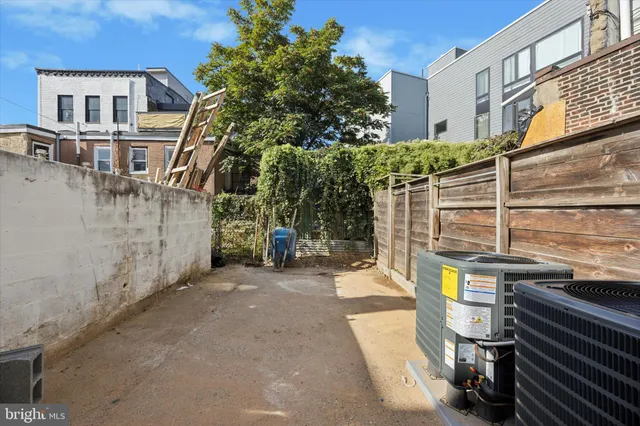 a view of a street with sitting area