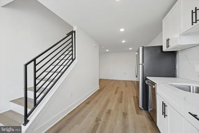 a view of a kitchen cabinets and wooden floor