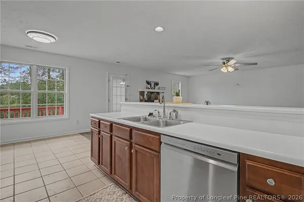 a kitchen with a sink and a stove top oven