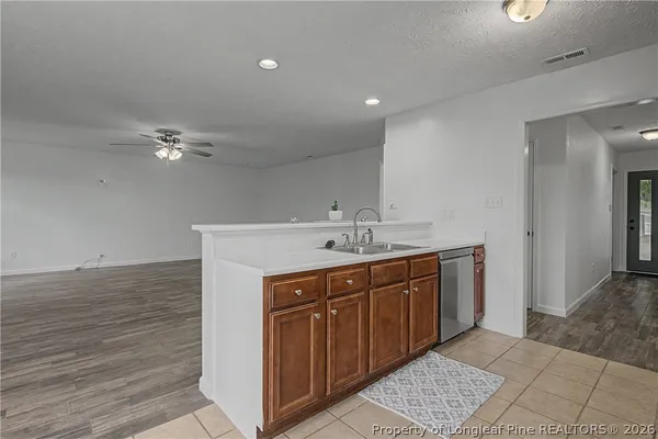 a bathroom with a sink a vanity and a mirror