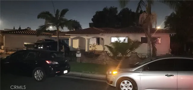 a front view of a house with parking space