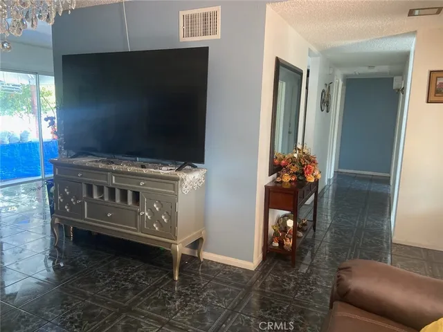 a kitchen with a stove and a chair