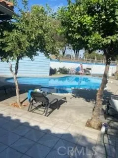 a view of backyard with outdoor seating and green space
