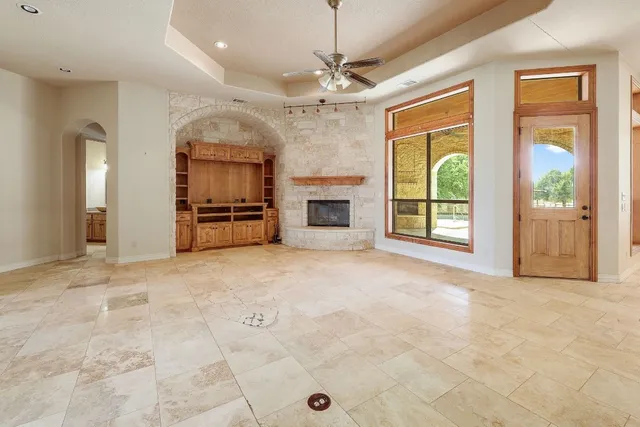 a large kitchen with granite countertop a stove a sink and dishwasher