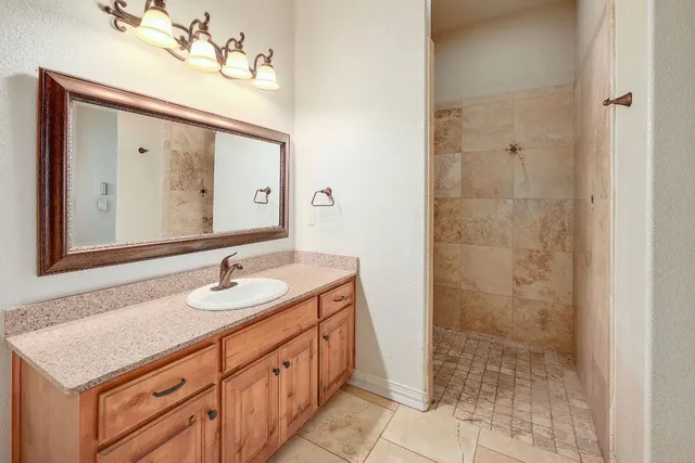 an empty room with closet and windows