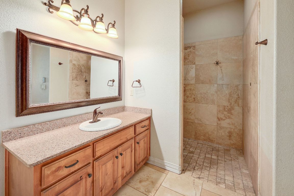 22300 Farm To Market Road 971 Granger, TX 76530 - Photo 21 of 37 a bathroom with a sink vanity and a mirror