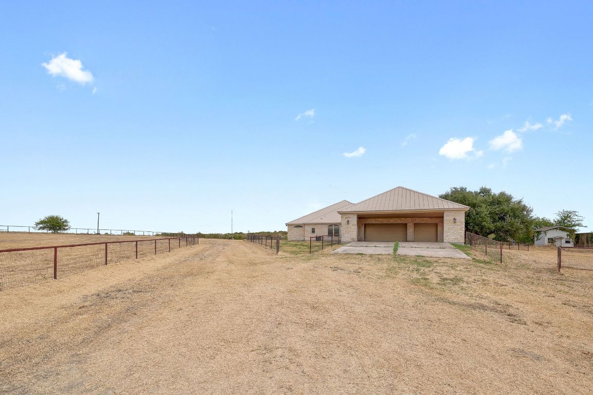 22300 Farm To Market Road 971 Granger, TX 76530 - Photo 30 of 37 a view of a house with a yard and a large tree
