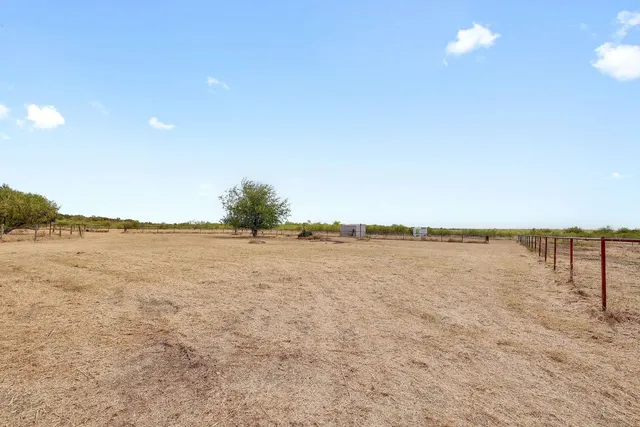 a view of a large house with a yard