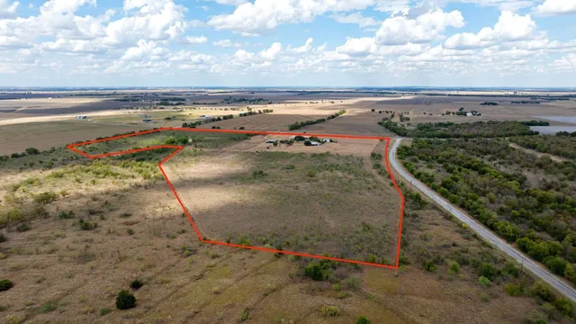 wooden floor in an empty room with a fireplace