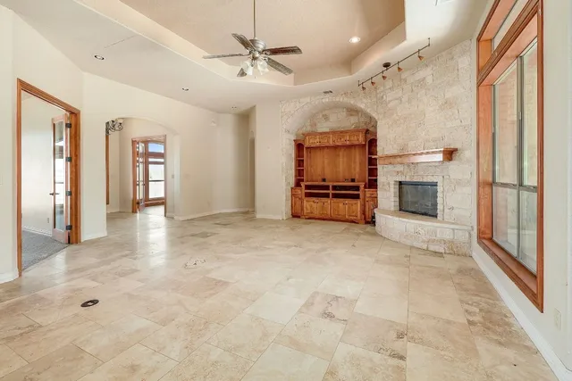 a large kitchen with stainless steel appliances granite countertop a stove and a sink