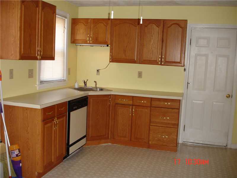 44 Pine Street Woonsocket, RI 02895 - Photo 4 of 10 Kitchen. Both units have updated oak kitchens with vinyl flooring. Large enough for table and chairs.