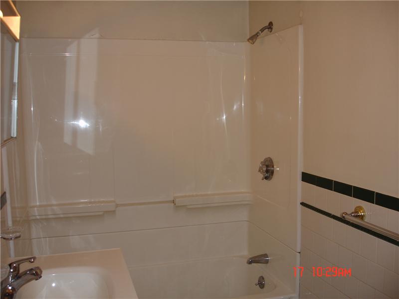 44 Pine Street Woonsocket, RI 02895 - Photo 8 of 10 Bathroom. Updated modern baths with tile wainscoating.