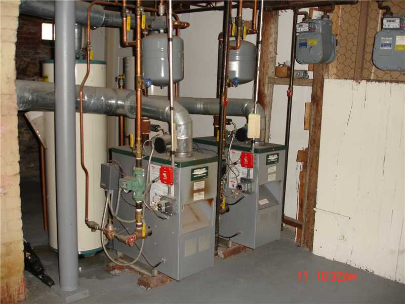44 Pine Street Woonsocket, RI 02895 - Photo 9 of 10 Cellar or Basement. Separate heating systems for forced water baseboard heating in each apartment. Each appartment has separate hot water tanks.