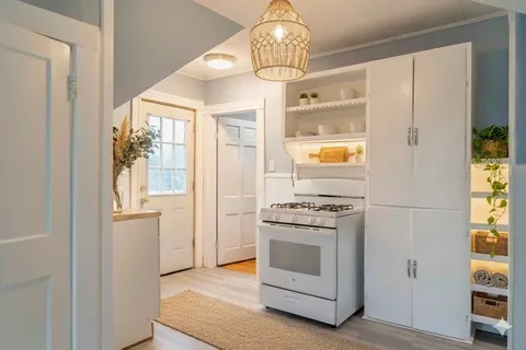 a kitchen with a stove and a refrigerator