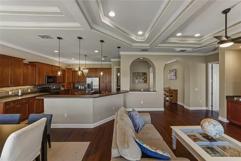a kitchen with granite countertop a sink counter top space appliances and cabinets