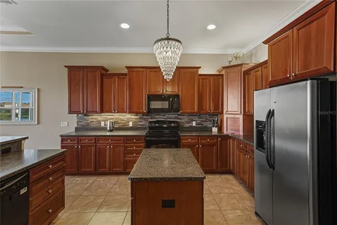 a bedroom with a bed dresser and a window