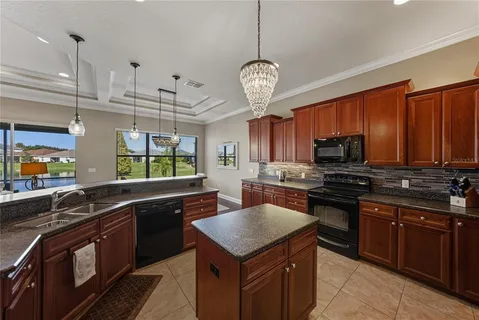 a spacious bathroom with a granite countertop sink a mirror and a shower