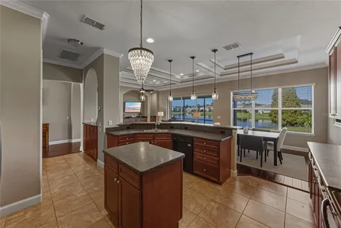 a bathroom with a granite countertop sink a mirror a bathtub and shower