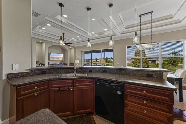 a bathroom with a granite countertop sink a toilet and a mirror