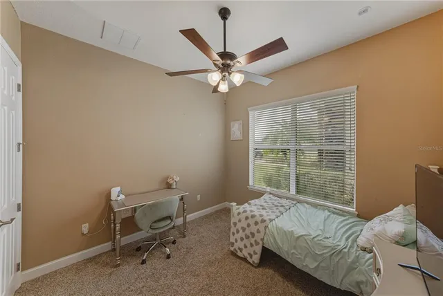 a bedroom with a bed and dresser