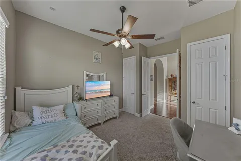 a view of a living room with kitchen view and wooden floor